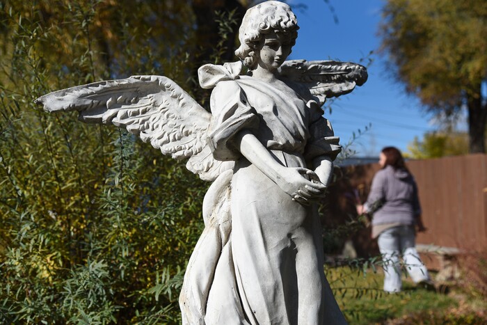 (Francisco Kjolseth  |  The Salt Lake Tribune)  A resident from the Center for Women and Children in Murray walks a portion of the Reflection Garden across the street from the center. The garden has been a place of healing and also acts as a memorial for those who have passed in their battle with substance abuse with stones bearing their names in the garden.
