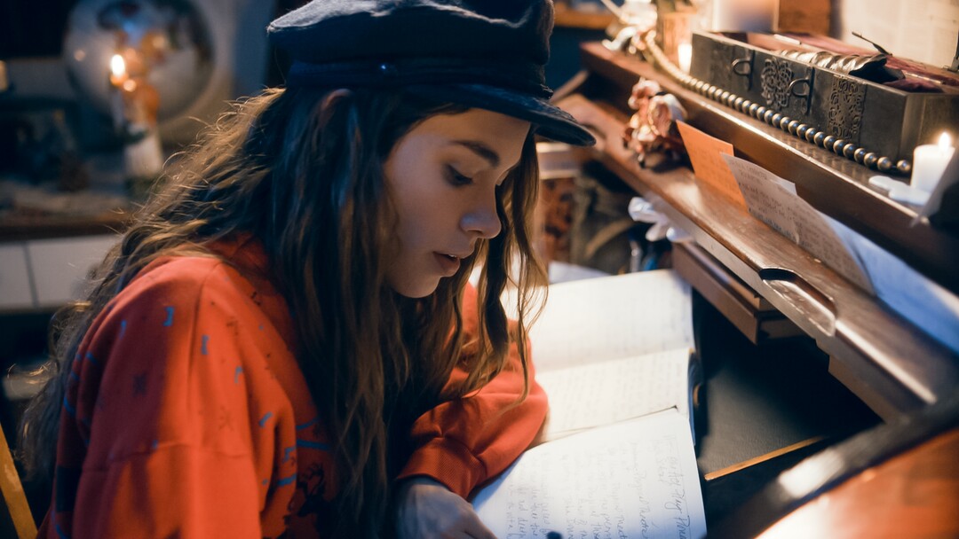 (Photo courtesy Pinnacle Peak Pictures) Jo (Sarah Davenport) works on her novel in a scene from director Clare Niederpruem's modern-day adaptation of Louisa May Alcott's "Little Women."