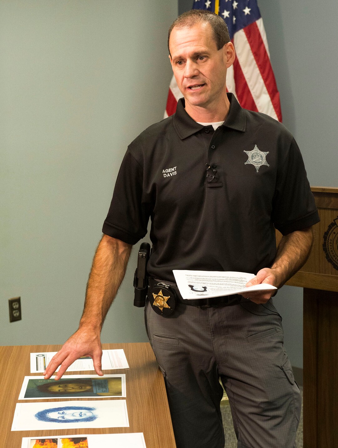 (Rick Egan  |  The Salt Lake Tribune)   Agent Brian Davis, from the Department of Public Safety, displays photos of the victim, as he asks for the public’s help identifying a murder victim in a cold case homicide from April 1998, during a news conference, Tuesday, Oct. 2, 2018.