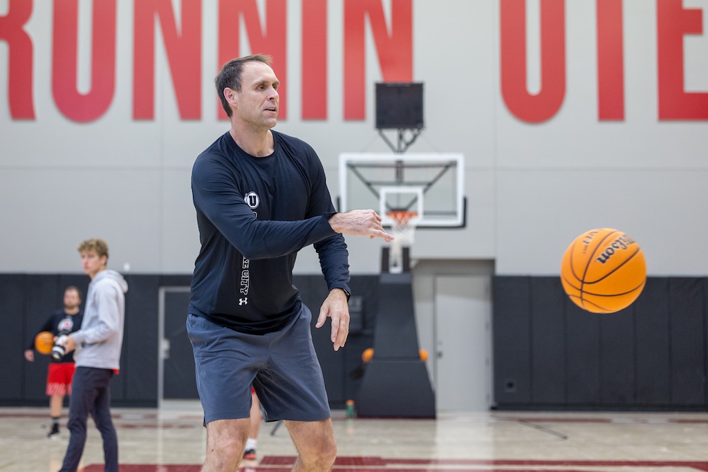(Utah Athletics) New Runnin' Utes assistant Chris Burgess helps run a practice on campus on April 19, 2022. Burgess left BYU for his alma mater this spring, bringing with him a reputation as a recruiter who builds lasting relationships.