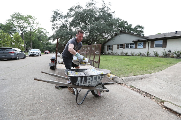 (Steve Gonzales | Houston Chronicle)  Grant Gaffney unloads sandbags from a flatbed Thursday, Aug. 24, 2017, in Houston. Tropical Storm Harvey intensified Thursday into a hurricane that forecasters said would be the first major hurricane to hit Texas in 12 years.