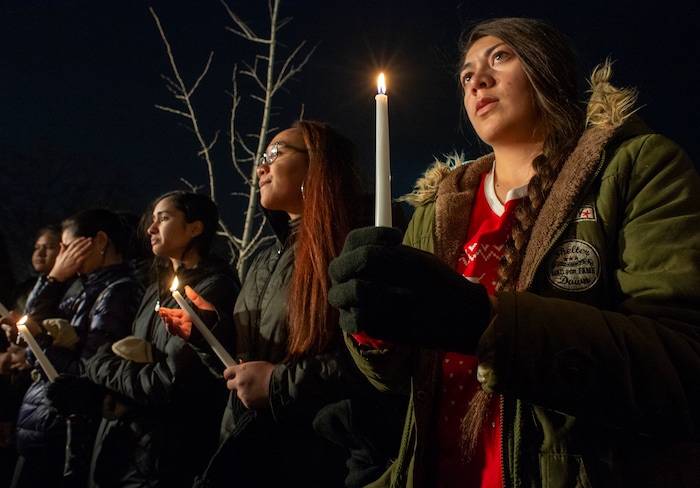 (Rick Egan  |  The Salt Lake Tribune)       BYU students gather at the Tanner building for a candlelight vigil on BYU campus, for the student who died by suicide this week, Friday, Dec. 7, 2018.
  
