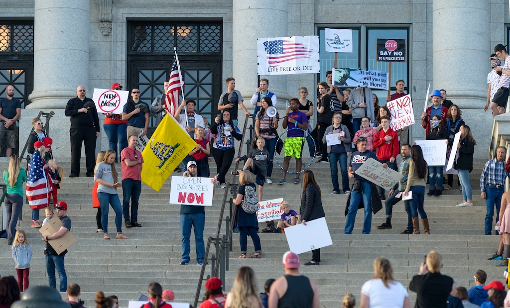 (Leah Hogsten | The Salt Lake Tribune) About 1,000 people protested the government mandated shutdown of businesses on the grounds of Salt Lake City Hall and then the group marched up to the Capitol, Saturday. The protest was organized by Utah Business Revival aimed at Mayor Erin Mendenhall, Salt Lake County Mayor Jenny Wilsonand Governor Gary Herbert policies on COVID-19 and social distancing, April 18, 2020.