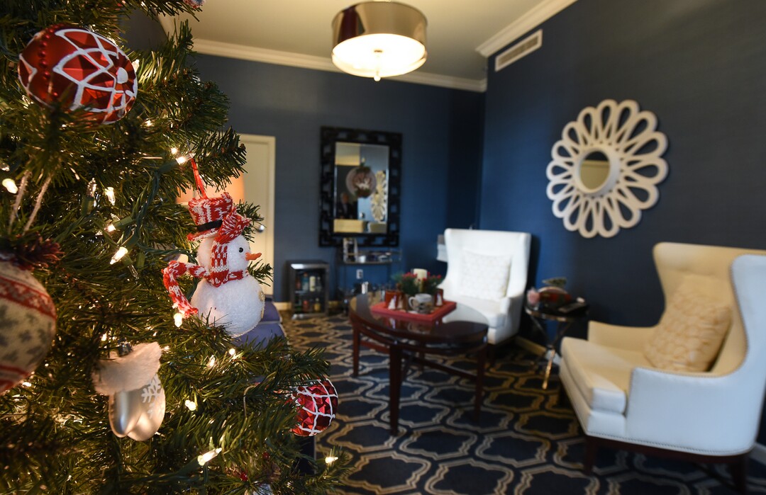 (Francisco Kjolseth  |  The Salt Lake Tribune)  The Christmas suite on the 15th floor of the Hotel Monaco is decorated for the holidays with lights, Christmas stockings and a tree.