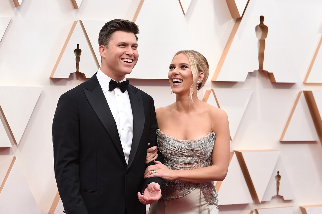 (Jordan Strauss | Invision/AP)  Colin Jost, left, and Scarlett Johansson arrive at the Oscars on Sunday, Feb. 9, 2020, at the Dolby Theatre in Los Angeles.