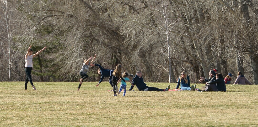 (Leah Hogsten  |  The Salt Lake Tribune) Families and friends congregate at Big Dee Park in Ogden on Sunday after hiking and biking the nearby Ogden River Trail. As the global battle against COVID-19 deepens, some Utahns have used the stateÕs great outdoors as an alternative to isolating at home. March 22, 2020 in Ogden.