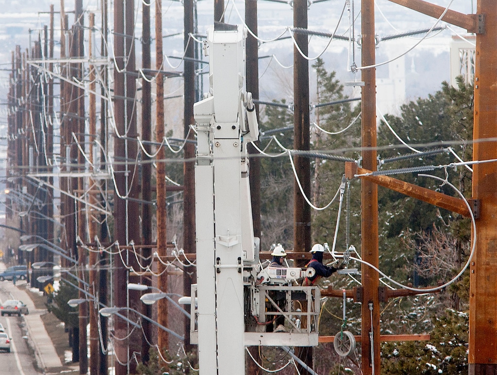 (Steve Griffin | The Salt Lake Tribune) A Rocky Mountain Power crew works on power lines near 800 south and Foothill Drive in Salt Lake City, Utah Monday February 25, 2013.