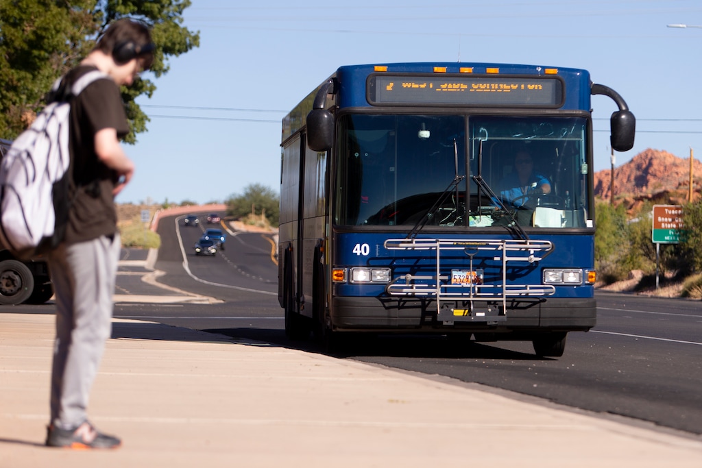 (St. George City) A passenger waits for a new Zion Route bus, which will be operated by SunTran, St. George's bus transportation system.