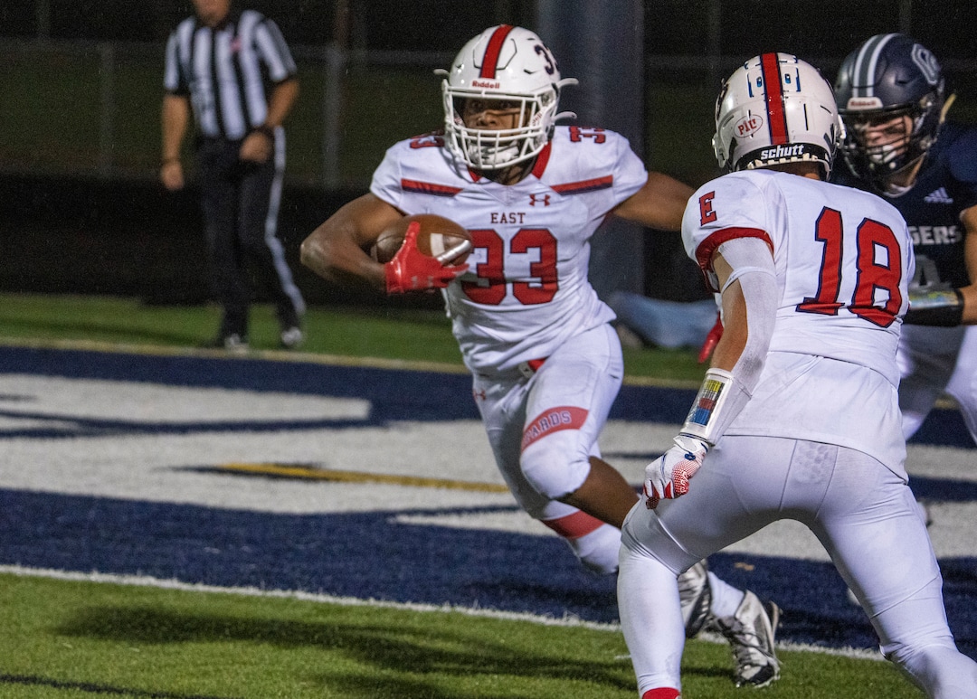 (Rick Egan | The Salt Lake Tribune)  Omar Shah runs the ball after intercepting a pass in the end zone for East High, in prep football action between Corner Canyon Chargers and the East Leopards, on Saturday, Aug. 21, 2021. He did not return to the game.