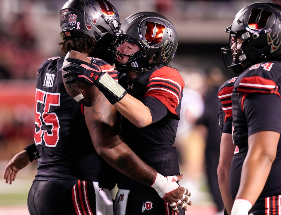 (Leah Hogsten | The Salt Lake Tribune)  Utah Utes quarterback Cameron Rising (7) hugs Utah Utes offensive lineman Nick Ford (55) as the University of Utah hosts the UCLA Bruins in Pac-12 football, Saturday, Oct. 30, 2021 at Rice-Eccles Stadium. 