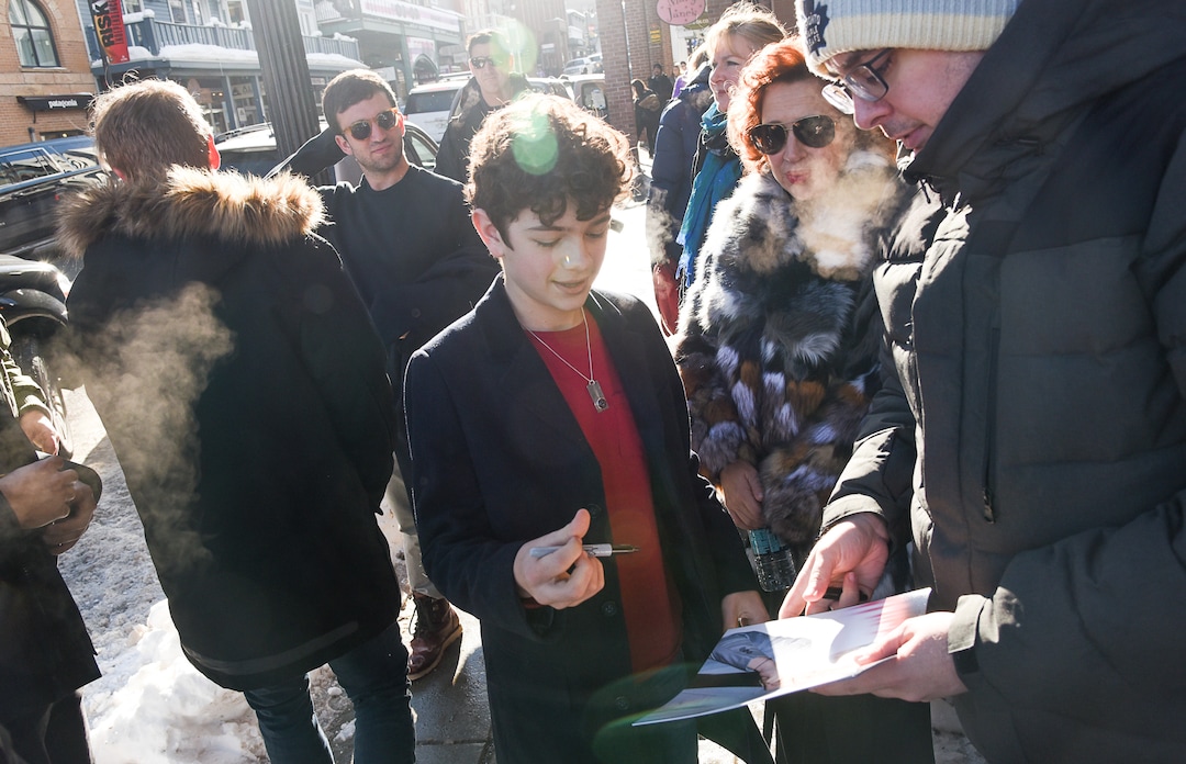 (Francisco Kjolseth  |  The Salt Lake Tribune)  Actor Noah Jupe signs autographs as the Sundance Film Festival kicks into high gear along Main street in Park City on Friday, Jan. 25, 2019.