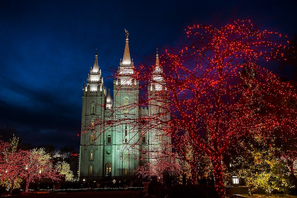 (Chris Detrick  |  The Salt Lake Tribune)  Visitors look at Christmas lights on Temple Square Friday, Nov. 24, 2017.