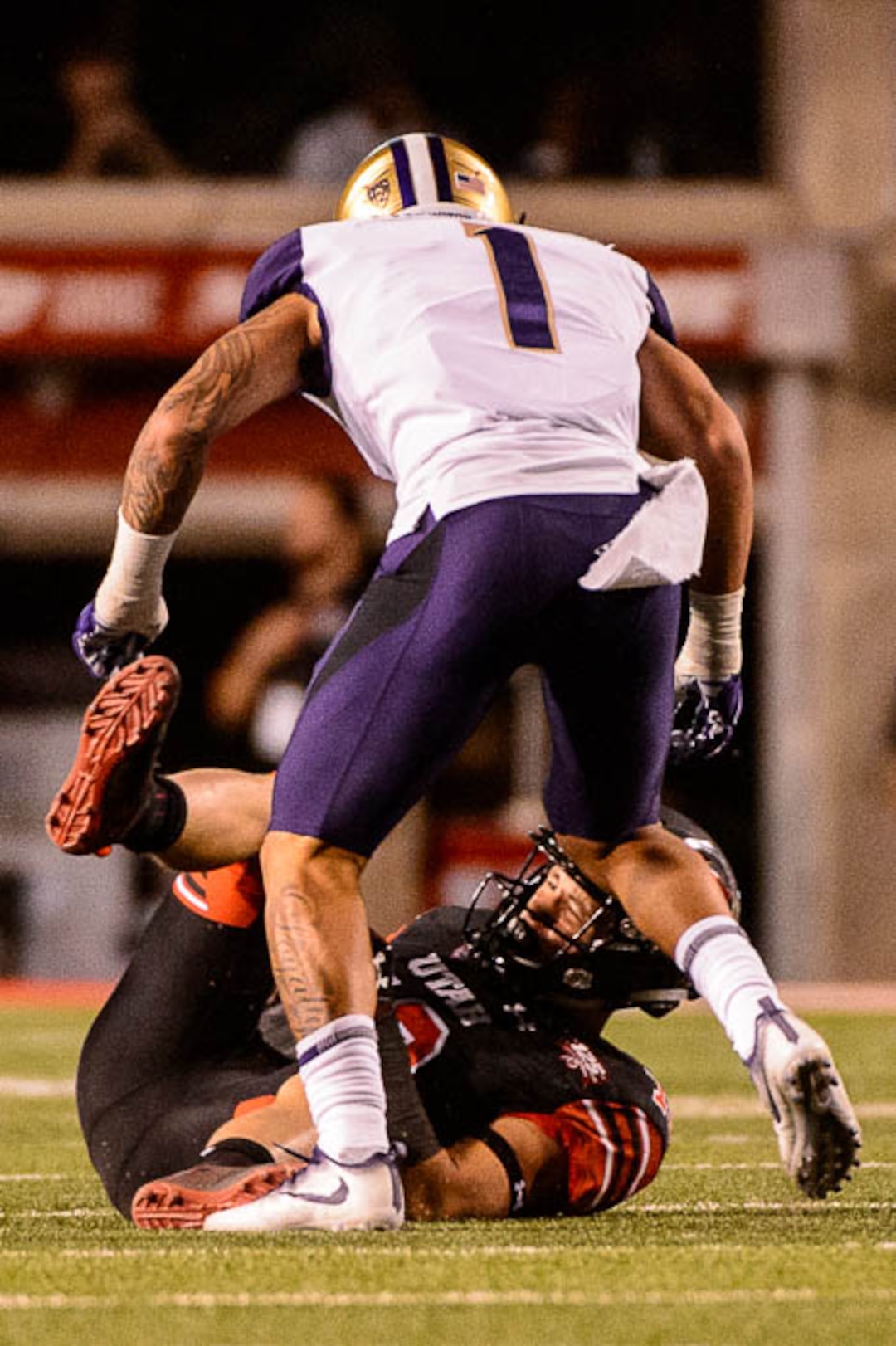 (Trent Nelson | The Salt Lake Tribune)  Utah Utes wide receiver Britain Covey (18) is hit hard by Washington Huskies defensive back Byron Murphy (1) as the University of Utah hosts Washington at Rice-Eccles Stadium in Salt Lake City, Saturday Sept. 15, 2018.