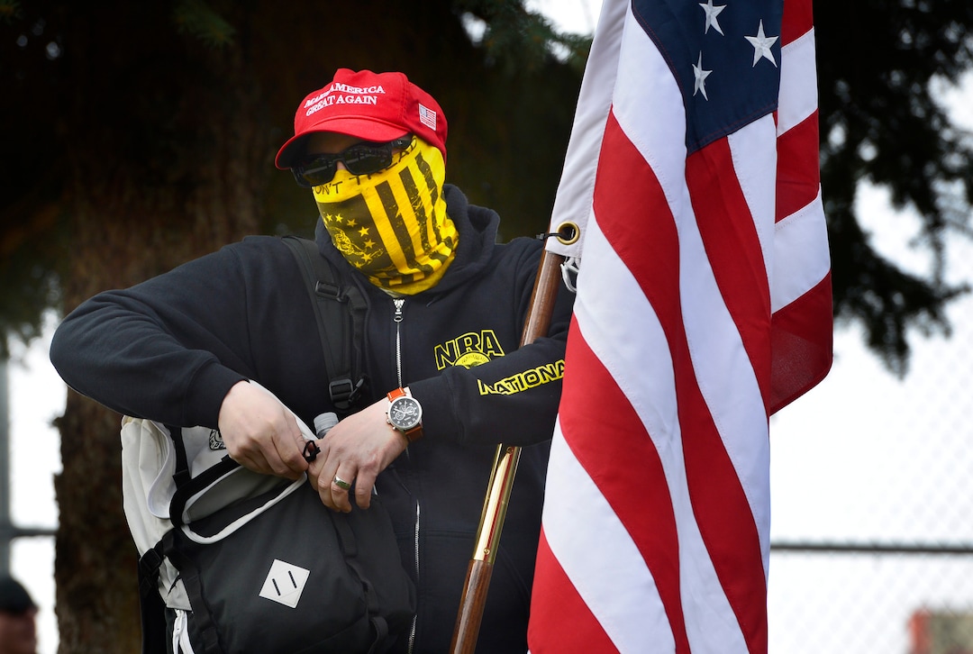 Scott Sommerdorf | The Salt Lake Tribune
A man who refused to give his name because he claimed he was mis-identified as a "counter protestor" at a previous rally stood with pro-gun March Before Our lives  marchers as they rallied across the street from West High School, Saturday, March 24, 2018.