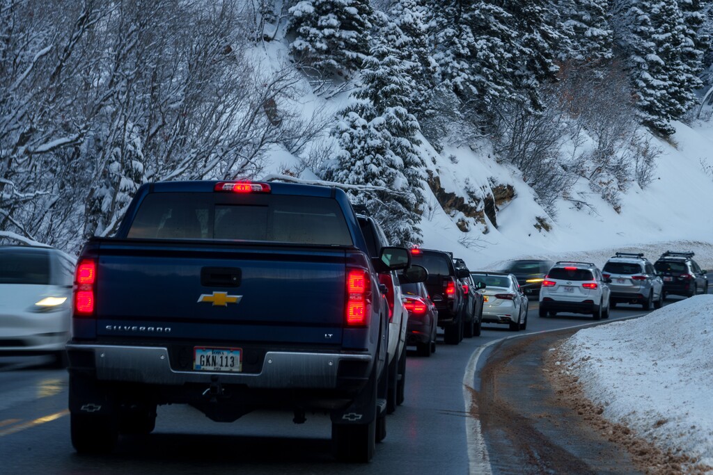 (Trent Nelson  |  The Salt Lake Tribune) Stalled traffic going up Big Cottonwood Canyon on Thursday, Dec. 29, 2022. A new shuttle service may help skiers reach the resorts.