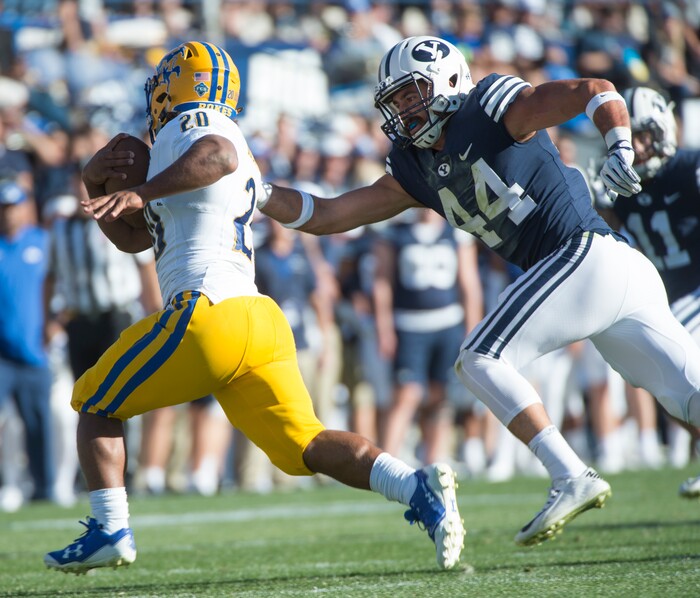(Rick Egan  |  The Salt Lake Tribune)     Brigham Young Cougars linebacker Riggs Powell (44) gets a hand on McNeese State Cowboys running back Justin Pratt (20), in football action between Brigham Young Cougars and McNeese State Cowboys, at Lavell Edwards Stadium, Saturday, Sept. 22, 2018.


