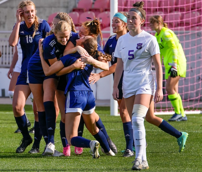 (Leah Hogsten | The Salt Lake Tribune) Skyline mobs Lily Boyden (11) after her late goal minutes before the end of the game during the 5A State Soccer Championship game on Friday. Skyline High School defeated Lehi High School, 3-1 to win the 5A Championship title Oct. 22, 2021 at Rio Tinto Stadium.
