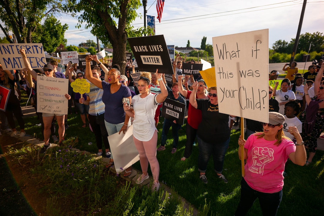 (Trent Nelson  |  The Salt Lake Tribune)A protest organized by Black Lives Matter and other groups at the Woods Cross Police Department on Friday June 14, 2019. The rally was to show support for DJ Hrubes, a 10-year-old black child who was held at gunpoint by a police officer last week while playing in his grandmother's front yard.