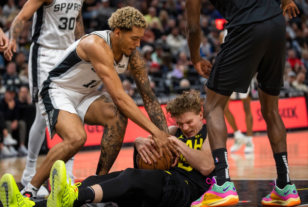 (Rick Egan | The Salt Lake Tribune) San Antonio Spurs forward Jeremy Sochan (10) and Utah Jazz forward Lauri Markkanen (23) go after a loose ball, in NBA action between the Utah Jazz and the San Antonio Spurs, at the Delta Center, on Wednesday, March 27, 2024.