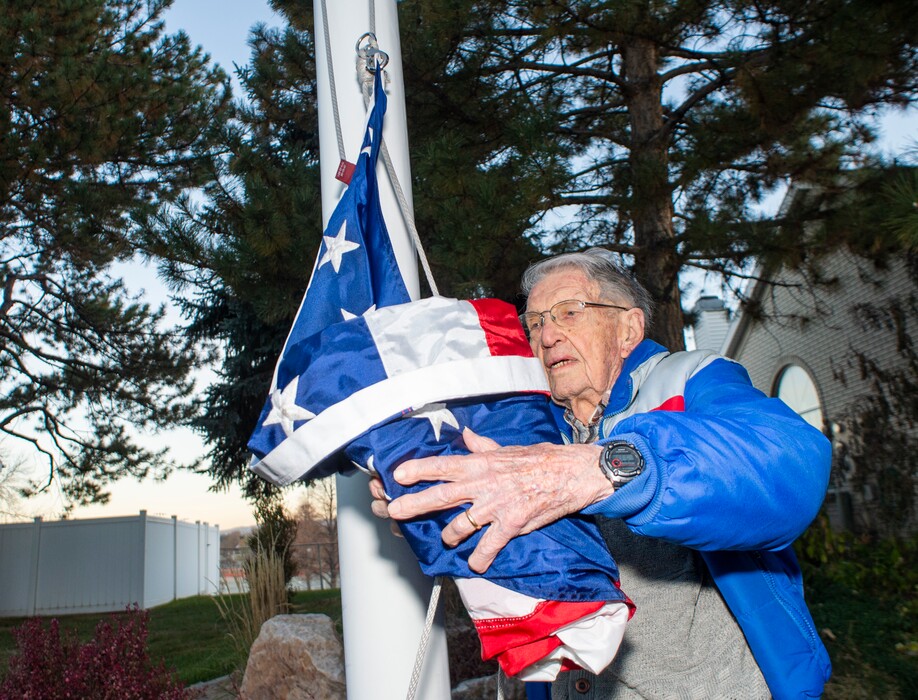 (Rick Egan  |  The Salt Lake Tribune)   Allen Tanner raises the flag at Country Corners Condominium in Millcreek, Friday, Nov. 8, 2019.