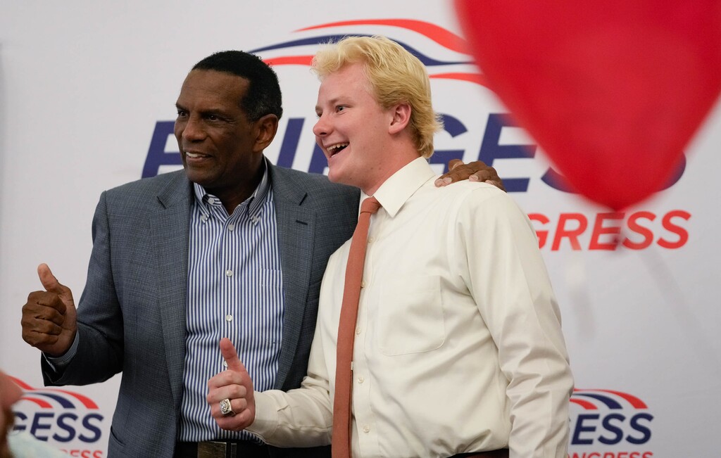 (Francisco Kjolseth  | The Salt Lake Tribune) U.S. Rep. Burgess Owens of Utah’s 4th Congressional District poses for a portrait with a supporter as he arrives for a GOP election night watch party, Tuesday, Nov. 5, 2024, in Draper.