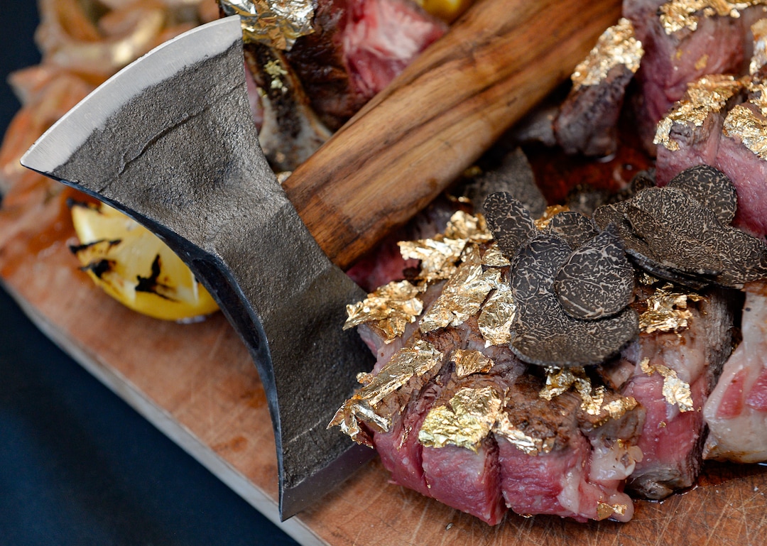 (Francisco Kjolseth  |  The Salt Lake Tribune) The 36-ounce Tomahawk steak at La Trattoria di Francesco costs a whopping $260 and is encrusted in edible 24k gold and served with shaved truffles.