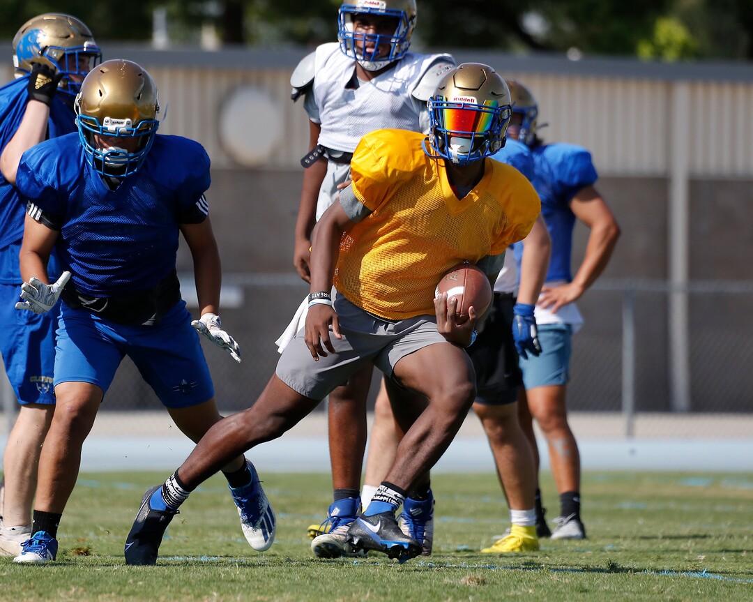 (Gary Kazanjian | Special to The Tribune) Clovis High School quarterback Nate Johnson works out with his team at Clovis High School, who committed to play for the University of Utah, shown Wednesday, July 28, 2021, in Clovis, Calif.