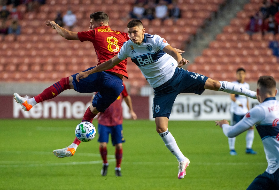 (Rick Egan  |  The Salt Lake Tribune) Real Salt Lake midfielder Damir Kreilach (8) and Vancouver Whitecaps defender Ranko Veselinovic (4) collide as they go for the ball, in MLS soccer action between Real Salt Lake and the Vancouver Whitecaps at Rio Tinto Stadium on Saturday, Sept. 19, 2020. 