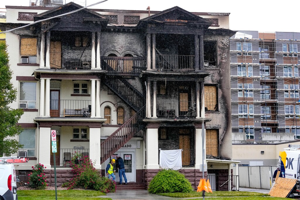 (Francisco Kjolseth | The Salt Lake Tribune) Disaster clean up crews work the scene of an apartment fire at 254 S. 300 East in Salt Lake City on Monday, May 30, 2022, where one fatality was reported, two civilian injuries and three fire fighters injured. The fire which displaced all residents is under investigation.