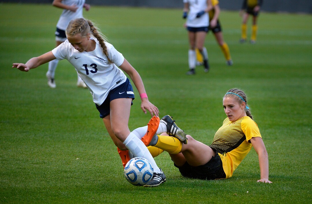 (Scott Sommerdorf   |  The Salt Lake Tribune)   Timpanogos' Emmy Fry, left, and Ivie Brynlie, right get tangled up during second half play. Maple Mountain won the shootout period after double overtime to win the 5A championship game over Timpanogos, Friday, October 20, 2017. 