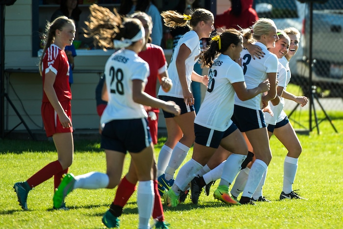 (Chris Detrick  |  The Salt Lake Tribune)  Bonneville's Hailey Price (3) celebrates with her teammates after scoring a goal during the game at Bonneville High School Wednesday, September 27, 2017.