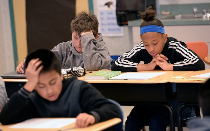 (Al Hartmann | The Salt Lake Tribune) Fifth graders work on a reading assignment in Kathleen Wilson's language arts class at Riley Elementary School in Salt Lake City Tuesday April 10, 2018. Utah’s average scores on the Nation’s Report Card for 2017 have improved from two years ago, but state officials remain concerned that minority and low-income students in the state continue to lag behind their peers.