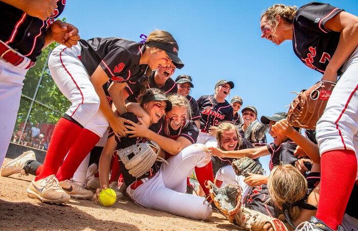 (Isaac Hale | Special to The Tribune) Spanish Fork players celebrate around pitcher Peyton Hall (14) after the Spanish Fork Lady Dons defeated the Mountain Ridge Sentinels in a best-of-three series to win the 5A state softball championship at the Spanish Fork Sports Park on Friday, May 28, 2021.