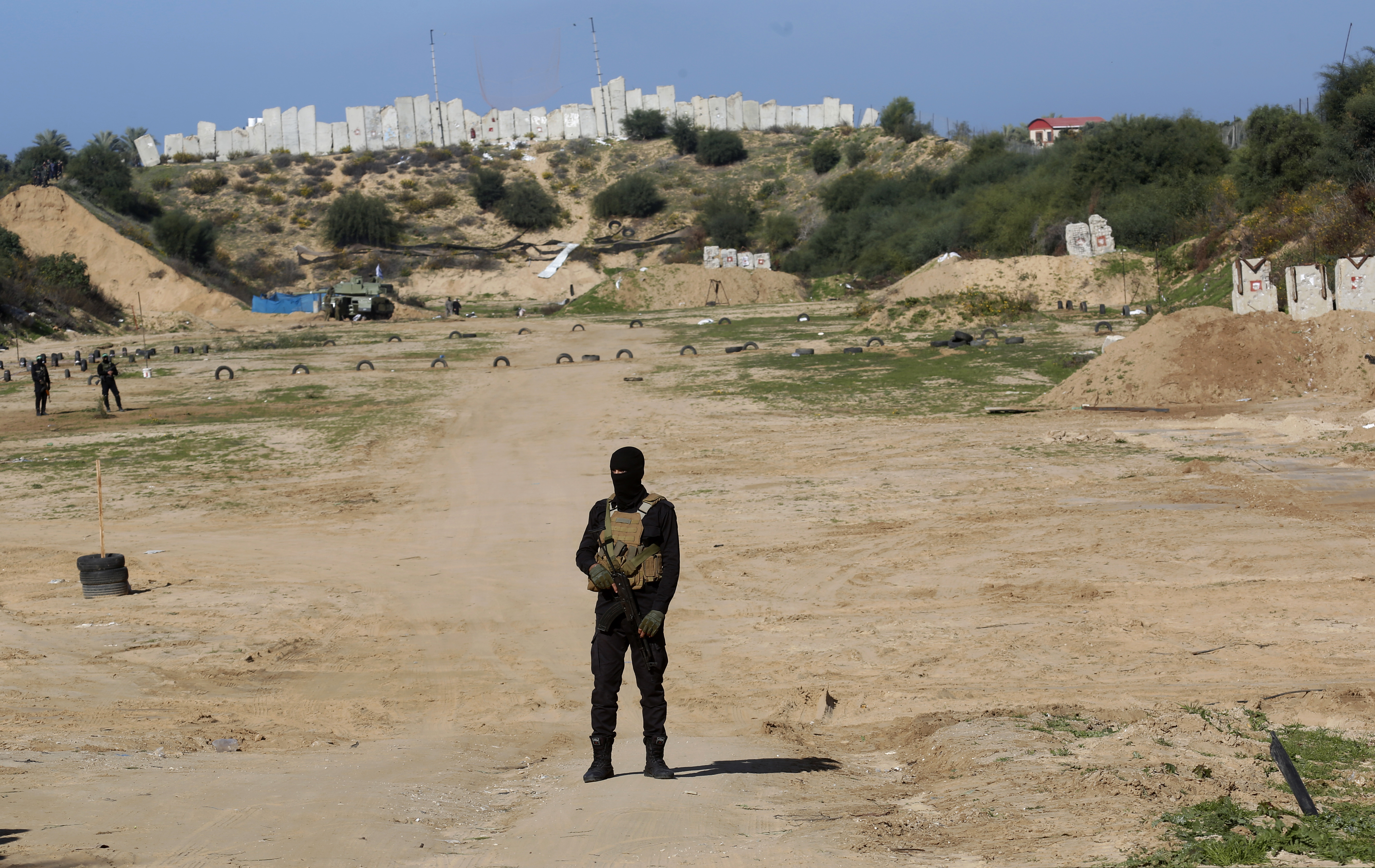 (Adel Hana | AP photo)

A Palestinian militant stands guard during a military drill organized by military factions outside Gaza City, Tuesday, Dec. 29, 2020.