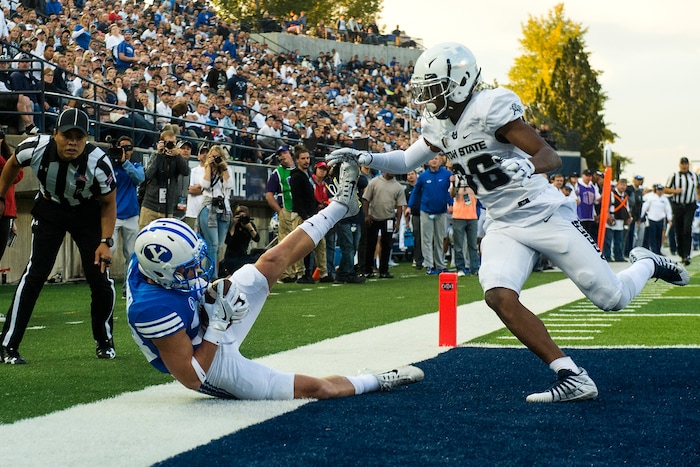(Chris Detrick  |  The Salt Lake Tribune)  Brigham Young Cougars wide receiver Beau Tanner (33) makes a touchdown catch past Utah State Aggies cornerback Ja'Marcus Ingram (36) during the game at Merlin Olsen Field at Maverik Stadium Friday, September 29, 2017.