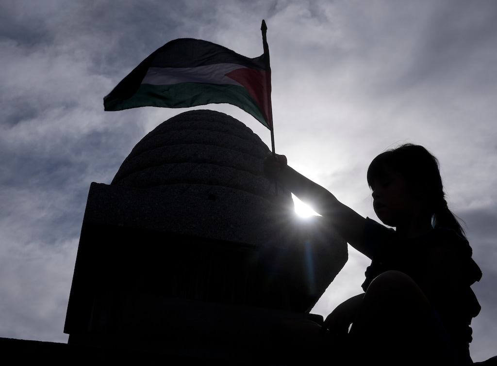 (Bethany Baker  |  The Salt Lake Tribune) A young girl holds up a Palestinian flag as demonstrators call for a cease-fire in Gaza during the latest Israel-Hamas war during a pro-Palestinian rally outside Provo City Library at Academy Square in Provo on Saturday, Nov. 4, 2023.