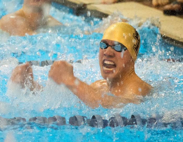 (Rick Egan  |  The Salt Lake Tribune)    Lone Peak Swimmer Johnnie Condie celebrates Lone Peak's state championship in the 200 Yard Freestyle relay, in 6A State Swimming Championships in Bountiful, Friday, February 9, 2018.