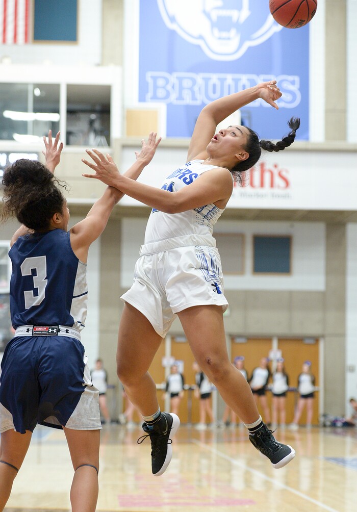 (Leah Hogsten  |  The Salt Lake Tribune)  Bingham's Meleane Lokotui (23) loses control of the ball.  Bingham faces Copper Hills in their semifinal game of the 6A High School Girls' Basketball Tournament at SLCC in Taylorsville, Friday, Feb. 23, 2018. 