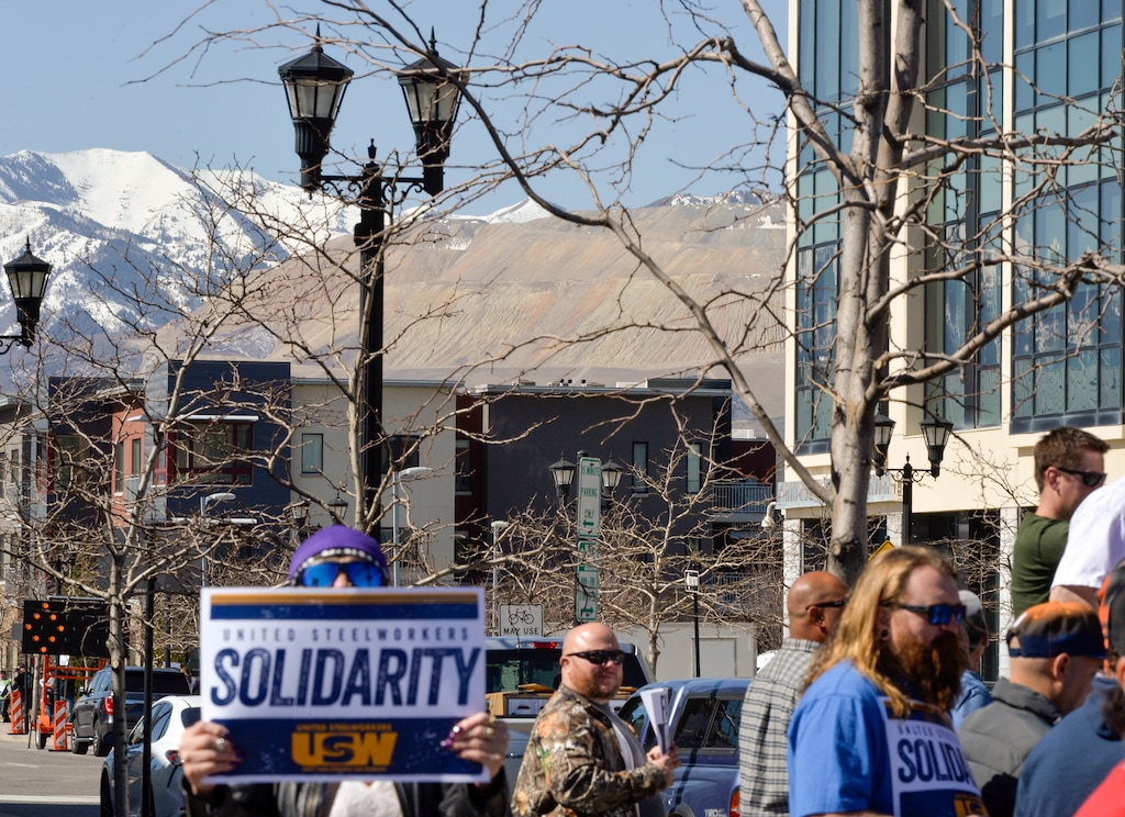(Chris Samuels | The Salt Lake Tribune) Rio Tinto's Kennecott Mine is seen in the distance as employees and supporters rally outside the company's office in South Jordan, Friday, March 25, 2022, in support of a new union contract.