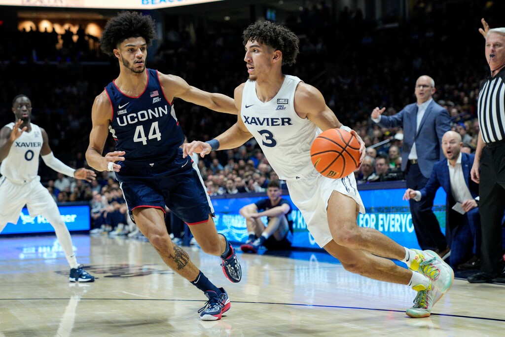(Jeff Dean |  AP file photo) Xavier's Colby Jones, right, and Connecticut's Andre Jackson Jr. are two players who could possibly be picked by the Utah Jazz with the No. 28 selection in the 2023 NBA draft.