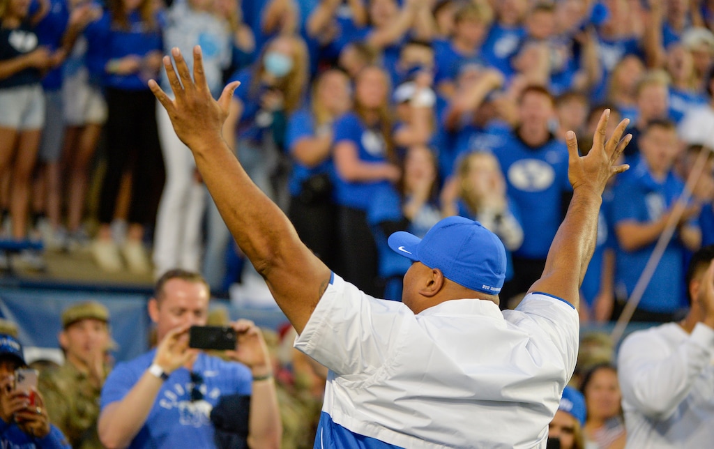 (Chris Samuels | The Salt Lake Tribune) Brigham Young head coach Kalani Sitake amps up the crowd before the Cougars play the Utah Utes in football, Saturday, Sept. 11, 2021 in Provo.