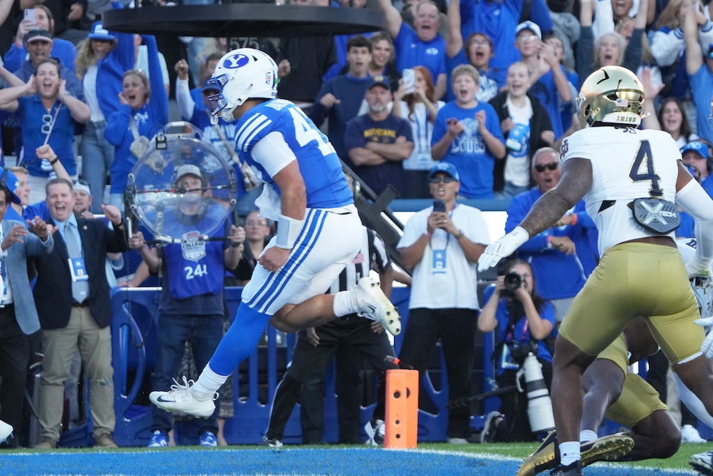 (George Frey | Special to The Tribune) BYU Cougars quarterback Bear Bachmeier (47) runs it in for a touchdown  during a game against Notre Dame Fighting Irish at LaVell Edwards Stadium on October 17, 2026.