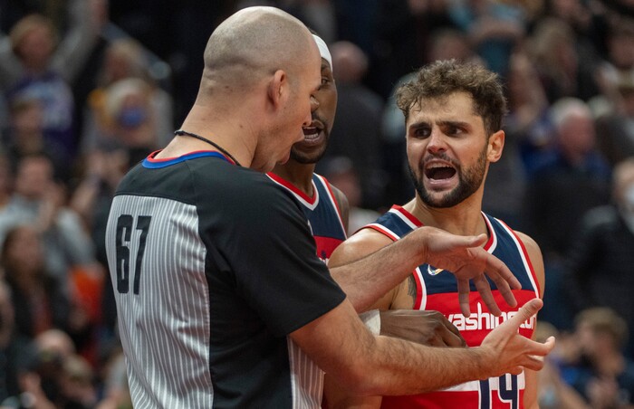 (Rick Egan | The Salt Lake Tribune) Washington Wizards guard Raul Neto (19), has a few words with referee Brandon Adair, in the final minute of the game, in NBA action between the Utah Jazz and the Washington Wizards, at Vivint Arena on Saturday, Dec. 18, 2021.