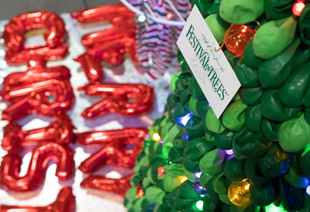 (Francisco Kjolseth | The Salt Lake Tribune)  A tree made with deflated balloons is displayed during the 51st annual Festival of Trees at the Mountain America Expo Center in Sandy on Tuesday, Nov. 30, 2021. The hundreds of elaborately decorated holiday trees and decorations that will be up for silent auction, with proceeds going to Intermountain Primary Children’s Hospital, will be virtual for the second year in a row due to the COVID-19 pandemic.