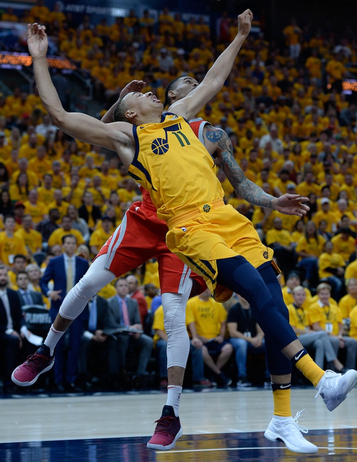 (Francisco Kjolseth | The Salt Lake Tribune) Dante Exum of the Utah Jazz takes a tumble landing on his elbow as the Utah Jazz take on the Houston Rockets in Game 4 of the NBA playoffs at the Vivint Smart Home Arena Sunday, May 6, 2018 in Salt Lake City.