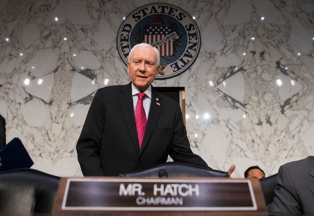 (AP Photo/J. Scott Applewhite, File) In this Nov. 13, 2017, photo, Senate Finance Committee Chairman Orrin Hatch, R-Utah, arrives as the tax-writing panel begins work on overhauling the nation's tax code, on Capitol Hill in Washington. Millions would forgo coverage if Congress repeals the unpopular requirement that Americans get health insurance, gambling with their own wellbeing and boosting premiums for others. Just as important, the drive by GOP senators to undo “Obamacare’s” coverage requirement fits in with Trump administration efforts to write regulations allowing for plans with limited benefits and lower premiums.