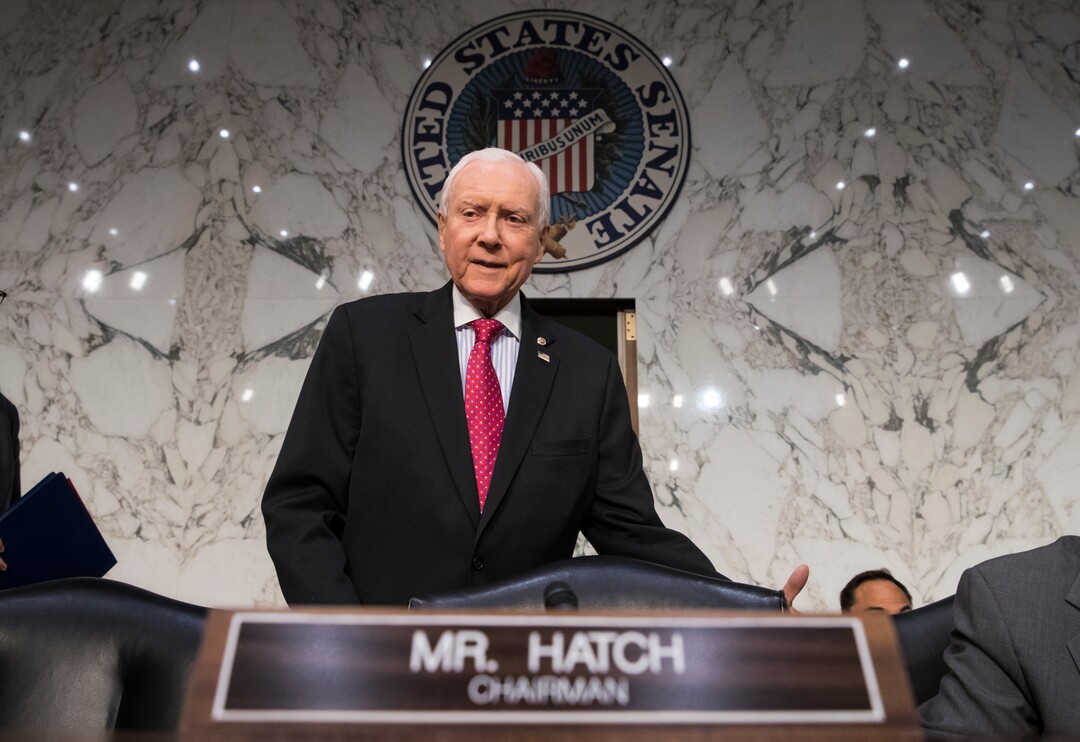 (J. Scott Applewhite  |  AP Photo)  In this Nov. 13, 2017, photo, Senate Finance Committee Chairman Orrin Hatch, R-Utah, arrives as the tax-writing panel begins work on overhauling the nation's tax code, on Capitol Hill in Washington. Millions would forgo coverage if Congress repeals the unpopular requirement that Americans get health insurance, gambling with their own wellbeing and boosting premiums for others. Just as important, the drive by GOP senators to undo “Obamacare’s” coverage requirement fits in with Trump administration efforts to write regulations allowing for plans with limited benefits and lower premiums.