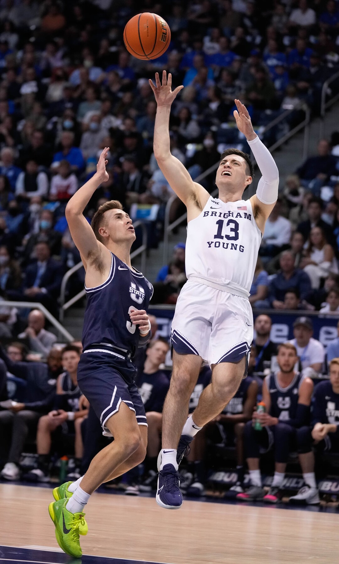 (Francisco Kjolseth | The Salt Lake Tribune) Utah State Aggies guard Steven Ashworth (3) tries to move in on Brigham Young Cougars guard Alex Barcello (13) in basketball action between the Brigham Young Cougars and the Utah State Aggies at the Marriott Center in Provo, Wednesday, Dec. 8, 2021.