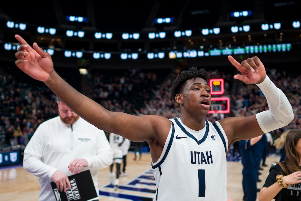 (Trent Nelson  |  The Salt Lake Tribune) Utah State Aggies forward Great Osobor (1) celebrates the win as Utah State faces San Francisco in Salt Lake City on Saturday, Dec. 16, 2023.
