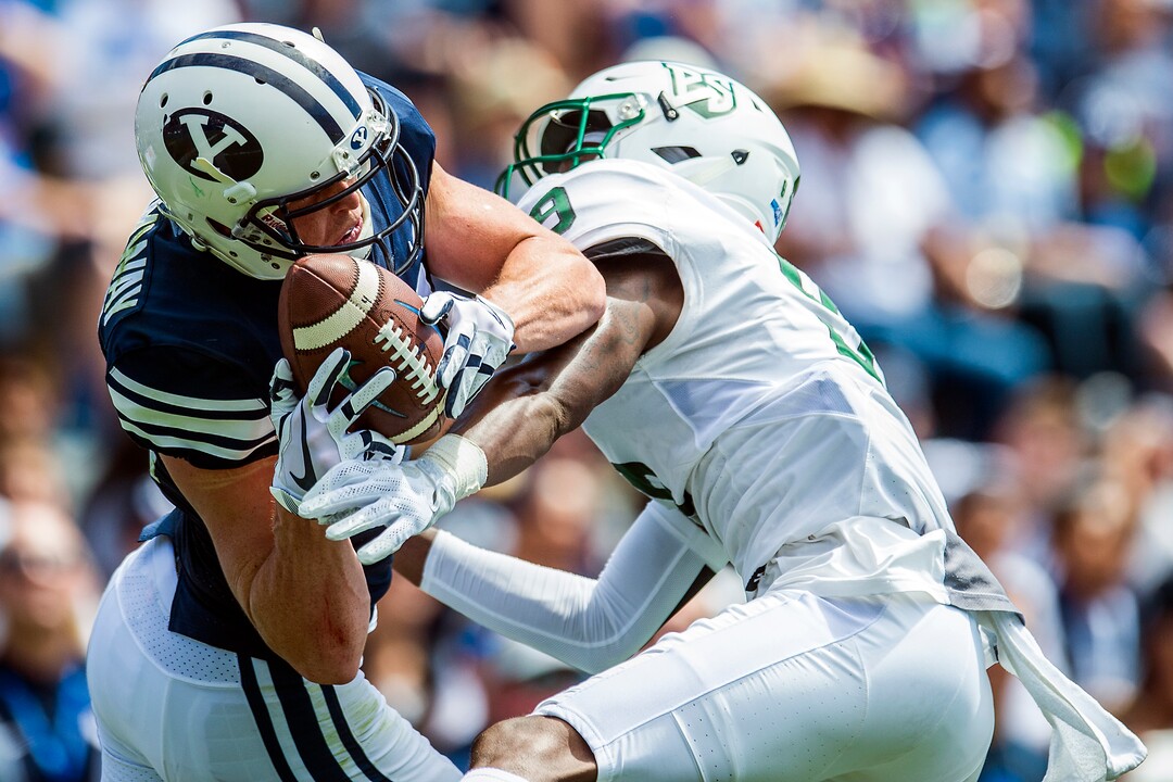 (Chris Detrick  |  The Salt Lake Tribune)  Brigham Young Cougars wide receiver Talon Shumway (21) makes a catch over Portland State Vikings cornerback Chris Seisay (9) during the game at LaVell Edwards Stadium Saturday, August 26, 2017.